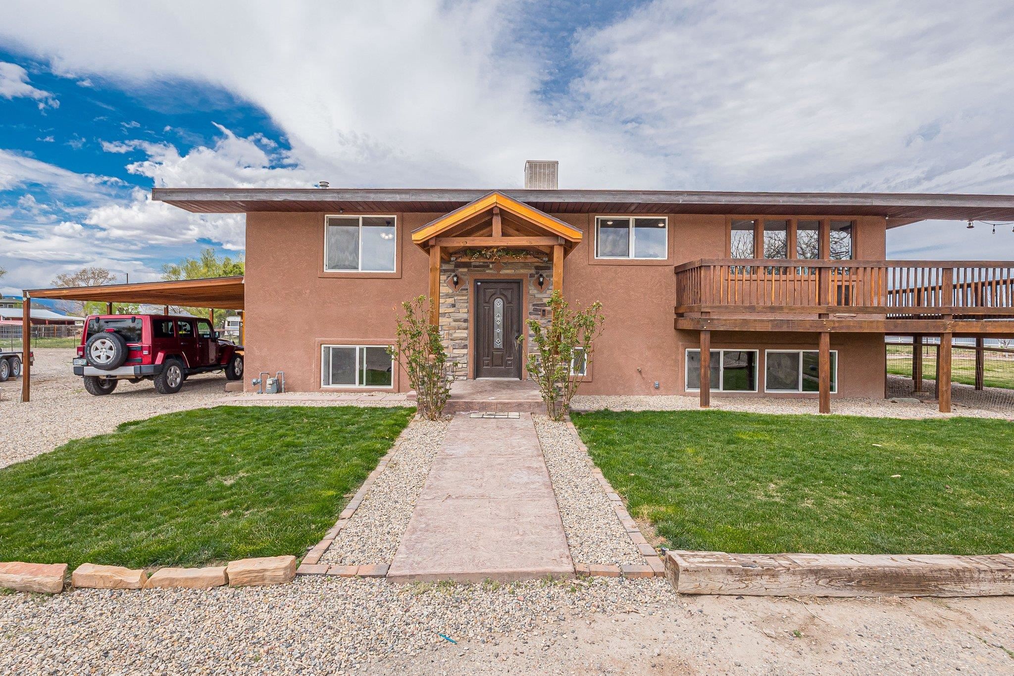 Come and see the spectacular views of the Mesa and Mt Garfield from this beautifully updated city close with country feel home on 2.02 acres with mature shade trees, fruit trees and a garden area. With over 2832 square feet, this 5-bedroom, 3-bathroom, home is completely fenced and cross fenced for critters, with plenty of RV parking and lots of room for toys in the large 30x29 workshop and 30x17 garage. This home is definitely a must see! Schedule your personal showing today!