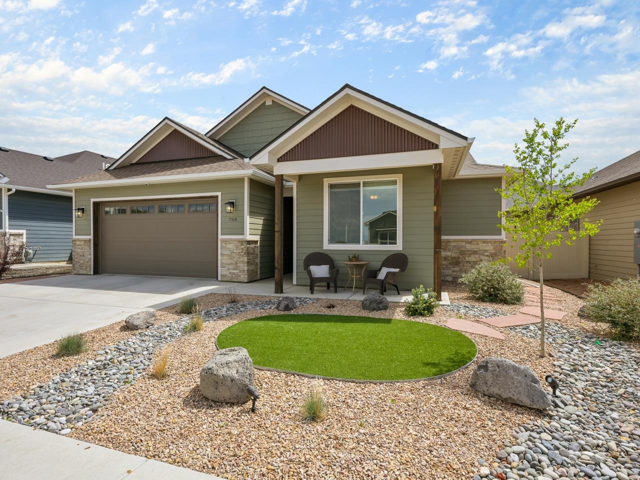 Welcome to this beautiful home nestled in the Silver Spur neighborhood of Northwest Grand Junction, Colorado. This immaculate residence offers the perfect blend of peace, comfort, and convenience, situated in a subdivision mere minutes from the amenities of town. This home is within proximity to schools, shopping destinations, and the recreation of Canyon View Park. Embrace a lifestyle of leisure and exploration without sacrificing the comforts of suburban living. Step through the inviting entryway and be greeted by the warmth and sophistication of the interior. Effortless flow guides you through the main living spaces, including a convenient laundry area and additional bedrooms. At the heart of the home lies the large open-concept living area, adorned with vaulted ceilings and the natural light streams through sizable windows. The adjacent kitchen features sleek solid countertops, a walk-in pantry, and newer stainless steel appliances, including a gas range, built-in microwave, and dishwasher. Illuminated by stylish light fixtures, the kitchen island breakfast bar invites casual dining and entertaining. Adjacent to the kitchen, discover a charming informal dining area with seamless access to the back patio. Two additional bedrooms, thoughtfully positioned towards the front of the home, offer versatility and comfort, complemented by a shared four piece bathroom with dual sinks, granite countertops, and elegant light fixtures. You will fall in love with the primary suite, flooded by natural light and offering the perfect retreat for relaxation. Enjoy the convenience of a spacious walk-in closet outfitted with ample shelving and storage, with the added convenience of a laundry area just steps away. Indulge in the en-suite bathroom, featuring a grand walk-in shower adorned with exquisite tile backsplash, dual sinks atop granite countertops, and a cozy relaxing ambiance. Outside, the covered patio provides an excellent space for enjoying the surroundings, with the option of unfurling screens for enhanced comfort and shade. The xeriscaped landscaping ensures effortless maintenance. Additional peace of mind is provided by the home's built-in security system. Don't miss this opportunity to make this exceptional residence your own. Schedule a showing today!