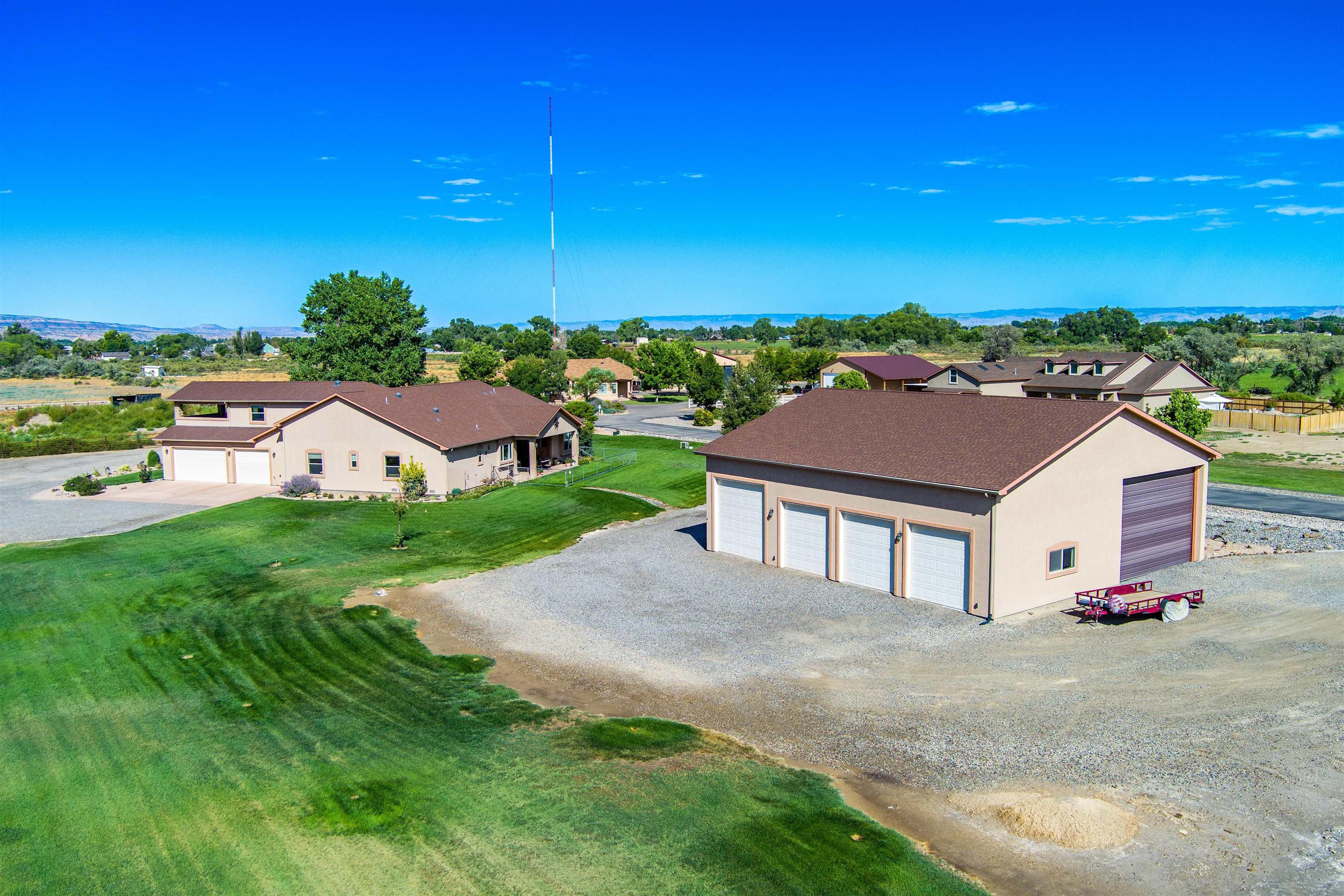 Over the top, pride of ownership. This home has it all. Just move in and enjoy this sprawling rancher with 2 master bedrooms on the main level 5 piece master bathroom. 3 bedrooms, 4 bathrooms, office, bonus room/game room and a 3 + car garage (detached has an RV bay plus an additional 4 bay garage (48 X 56).  Tucked back in a private cul-de-sac. 2 acres professionally/fully landscaped. Breathtaking views off your West facing back patio to enjoy your cool mornings and shady afternoons. Beautiful wood flooring and granite and high ceilings throughout. Gas fireplace in living room. Central vac system. In floor radiant heat. wired for surround sound. Detached RV/garage shop with (2) 220 amp also has a gas heater in one bay. Plenty of room for all your toys and then some. Three covered patios!!  Views from this property are like none other!!