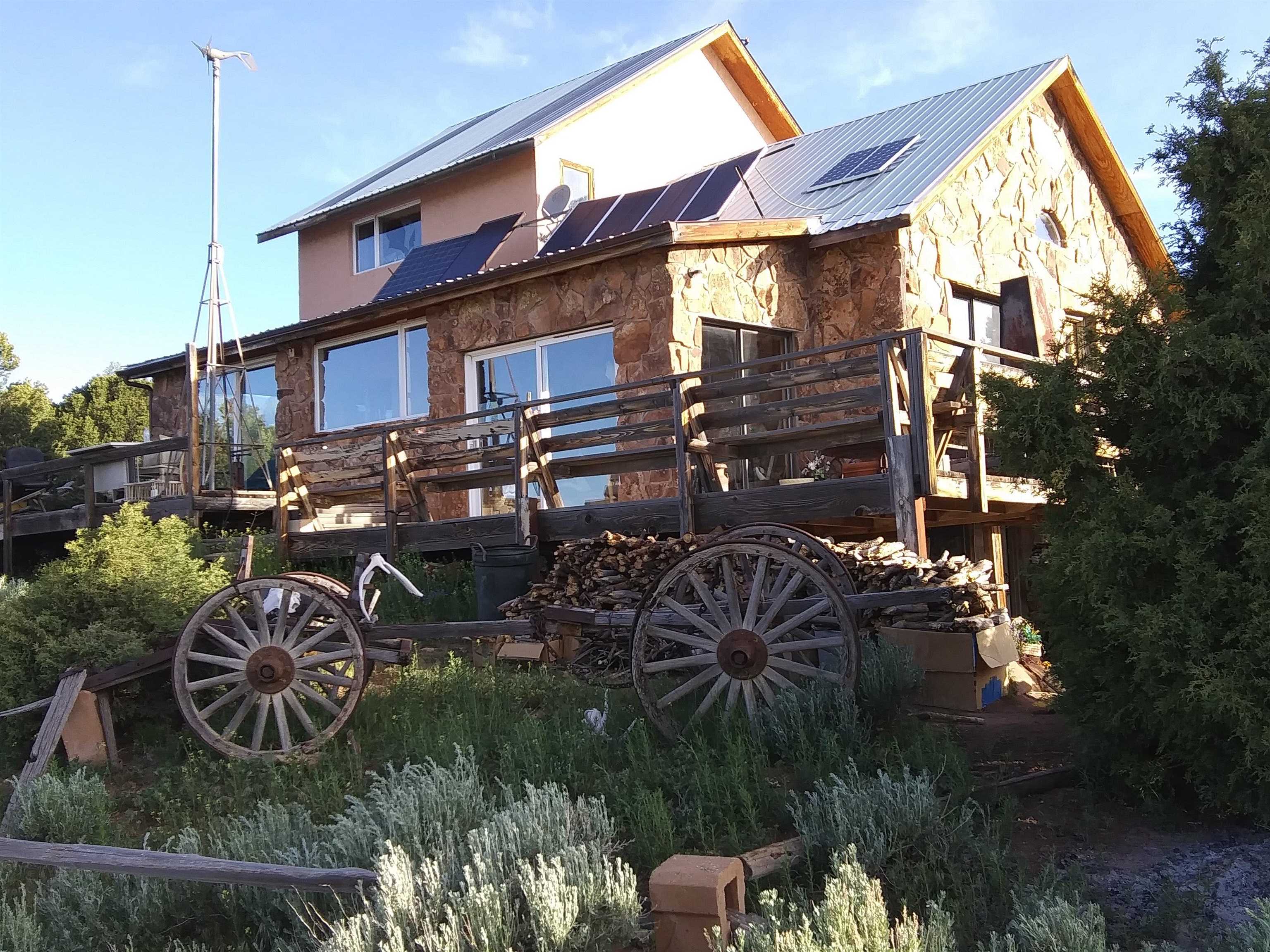 This cabin is located up in the beautiful country of the Uncompahgre divide road. Getaway from the city and enjoy the fresh air and surrounding beauty. This Cabin has a large spacious living room with , Vaulted ceiling. Enjoy the warmth of a nice Wood fireplace . One large loft upstairs used for a bedroom including one can use  basement for another bedroom. Attached is a sun room with a small waterfall in place.. This place has a a lot of potential . A fence is in place so bring your horses and enjoy a ride through the forest. The home has nice masonry stone on the front and the side plus the outside chimney. Please call your agent or selling agent to show the property. All information subject to change but not limited to sq. footage, measurements ,pricing, and availability are all subject to change/error without notice. Buyer's to verify all information.