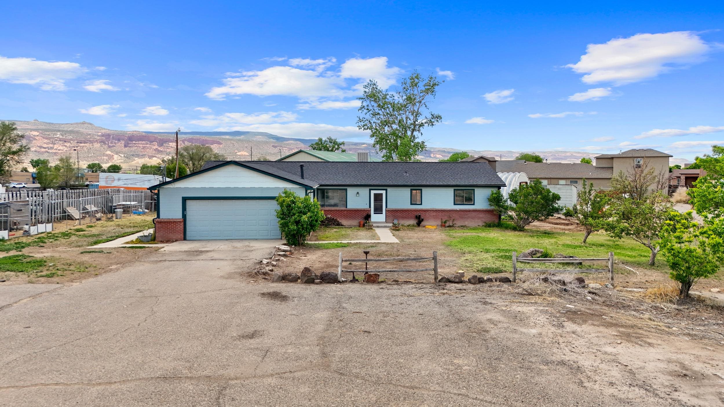 Welcome to the auto enthusiasts dream property! Situated on a sprawling 3.14-acre lot in the heart of Fruita, this property offers the ultimate haven for auto lovers. With its convenient C-1 zoning, the possibilities are endless.  The main highlight of this property is the impressive 3720 square foot shop, complete with multiple outbuildings. This setup is perfect for an auto body shop, collector, or hobbyist looking to indulge their passion. The shop features a reception area, providing a professional and welcoming space for clients. Ample storage ensures that you have plenty of room for all your tools, equipment, and supplies. The addition of a bathroom and the potential for living quarters add convenience and flexibility to the setup.  In addition to the fantastic shop, the main house is equally impressive. Boasting 3 bedrooms and 3 bathrooms spread across a generous 2694 square feet, this home offers a comfortable and spacious living environment. Numerous updates have been made throughout, including a beautifully remodeled kitchen with stunning granite countertops and updated appliances. The attention to detail and custom work done make this property truly unique and a pleasure to call home.  Don't miss your chance to own this exceptional property that caters to your automotive passions. Whether you're a professional in need of a well-equipped shop or a hobbyist seeking the perfect space for your collection, this property has it all. Schedule a viewing today and experience the incredible potential of this auto enthusiasts dream!