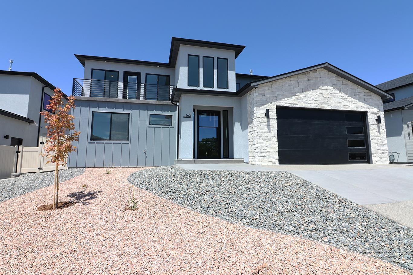 MOVE IN READY WITH FULL LANDSCAPING, FENCING & WINDOW BLINDS INCLUDED IN THIS GORGEOUS NEW HOME featuring high ceilings, 10' interior doors & impressive loft walkway on the 2nd floor. Loads of windows for maximum natural light and views. Primary bdrm on the main level. 4 Bdrm, 3 ba, plus bonus and reading nook upstairs, 2334 sq ft. Black stainless kitchen appliances, gas fireplace and garage is equipped with a 220V car charger.  Hot tub subpanel on covered back patio.  1 block to the grocery store, restaurants, Bookcliff Country Club & less than 10 minutes to the airport, St. Mary's, downtown & Community Hospital. Use Our Builder Advantage program can help you get 1% in closing costs through sellers preferred lender.