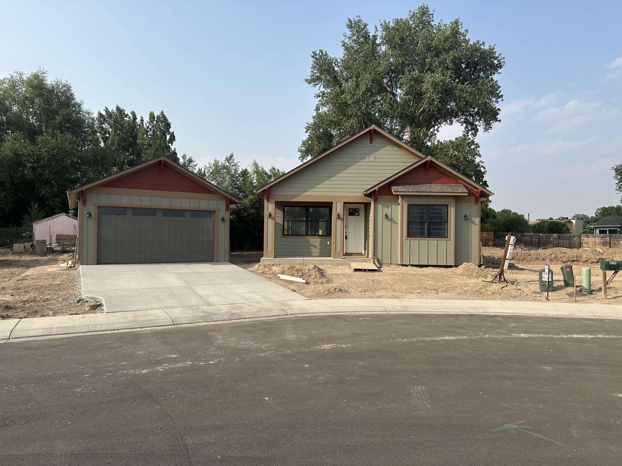 If you've been looking for new construction with charming architecture in downtown Fruita, this is the one! Plus, it has a finished ADU! Main house features 3 bedrooms, 2 bathrooms, a primary suite with two walk-in closets, a beautiful kitchen with quartz countertops, and a cozy living room with fireplace. The detached garage/ADU has a 1 bedroom, 1 bathroom apartment that would make a great rental unit, guest house or in-law suite. Front landscaping and custom steel fencing are included in the price.  Total approximate square footage includes ADU.