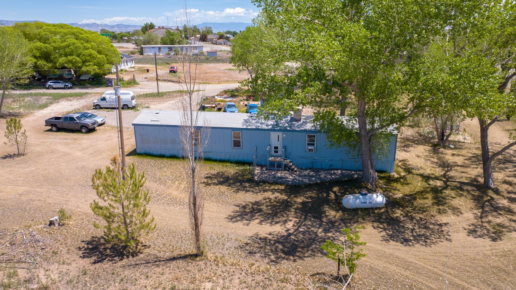 This clean, well-maintained lot features a huge yard, storage sheds, and plenty of space. The mobile home would make a great rental property and consists of several parcels ( 6 total ) which may allow room to place another home on the property making it an ideal investment. There is even room to build a shop or even keep a couple of horses. No HOA on this one!  Parcel #2691-334-08-002 Parcel#2691-334-09-004 Parcel#2691-334-09-005 Parcel#2691-334-09-006 Parcel#2691-334-14-001 #2691-334-09-002 also included in this sale. If you are looking for a nice, quiet, tranquil country living that is still close to civilization this is the place for you.