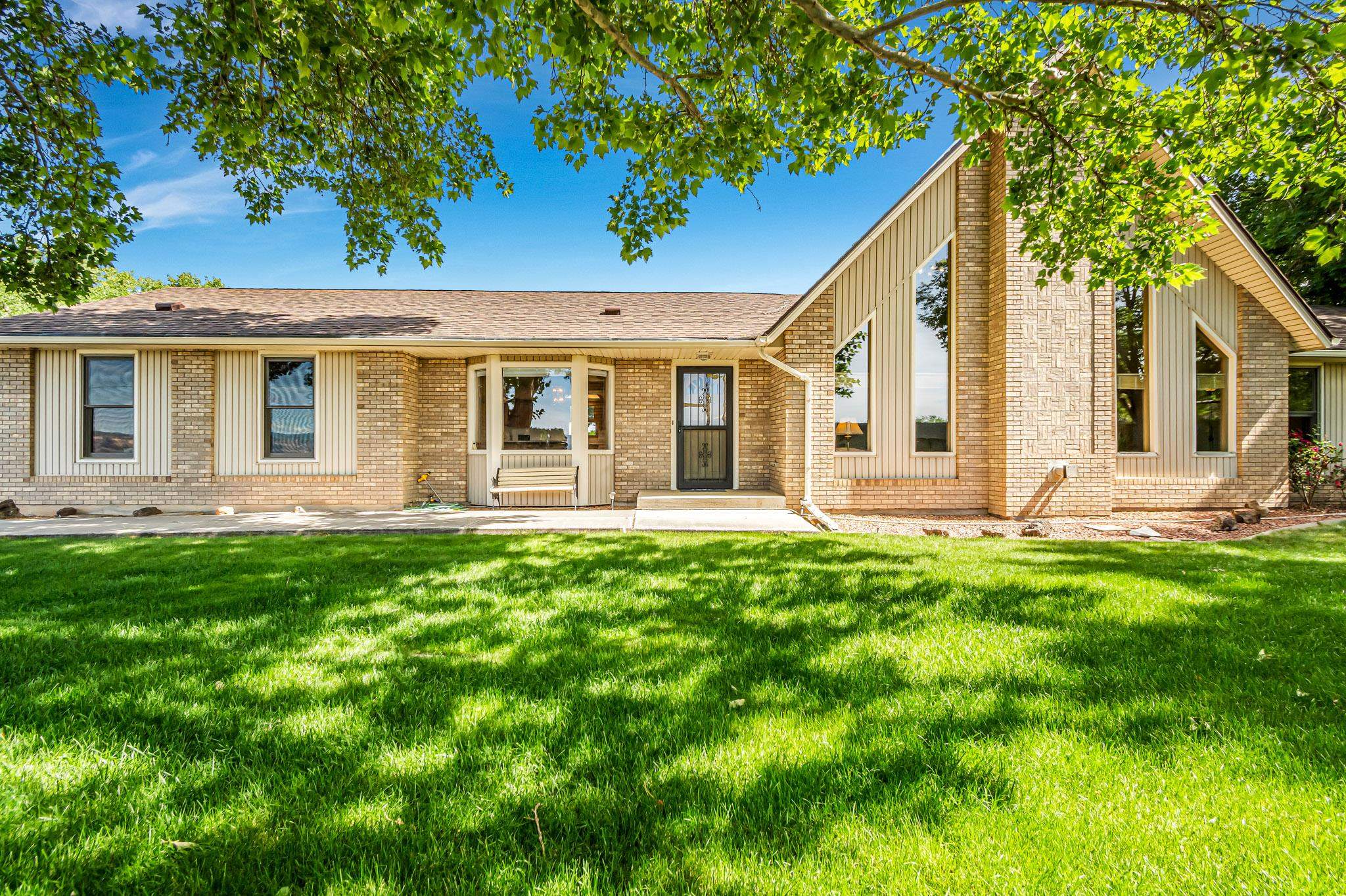 Price reduced!!! Motivated seller! Move in ready 3-2-2 with an open floor plan, upper bonus room, detached 896 sqft workshop on 0.8 acres and no HOA in North Grand Junction. The second bathroom is a jack and jill bathroom - great for guests and families. South facing windows have views of the monument. Do not miss this unique opportunity to live in the countryside just minutes from town. New roof 2022. New irrigation pump 2024. Open house July 7 Noon-3pm.