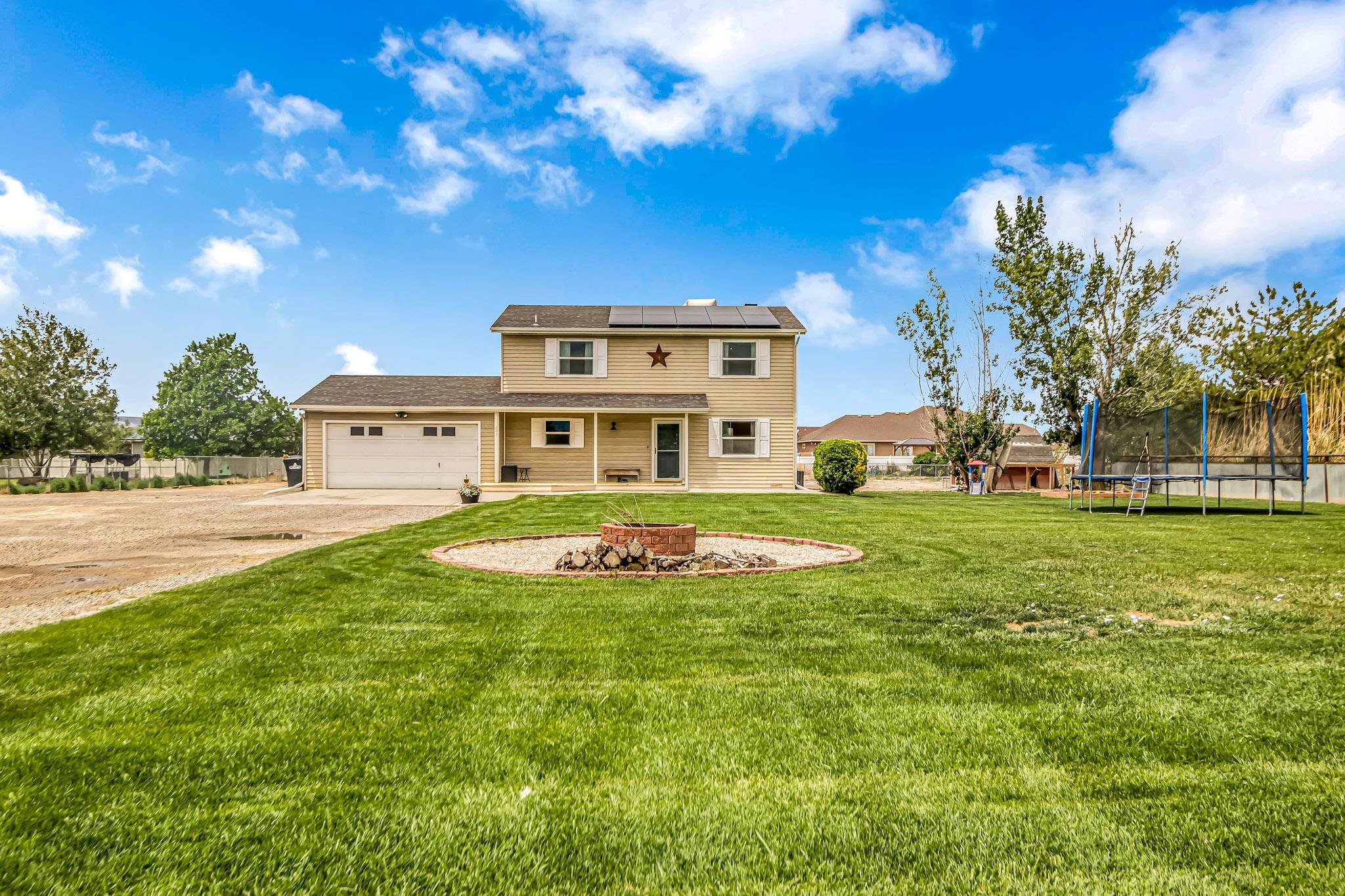 This beautifully updated home sits on nearly one acre, and it's ready for a new owner! The home itself has updated vinyl flooring, stainless appliances, solar panels, and much more. Outside you'll have all the room you need to create your vision! Do you need a shop? Plenty of room to build one on this lot! The metal fencing was new in 2022, and the gate closes securely to keep your worries away from 30 Road. Schedule your showing today!