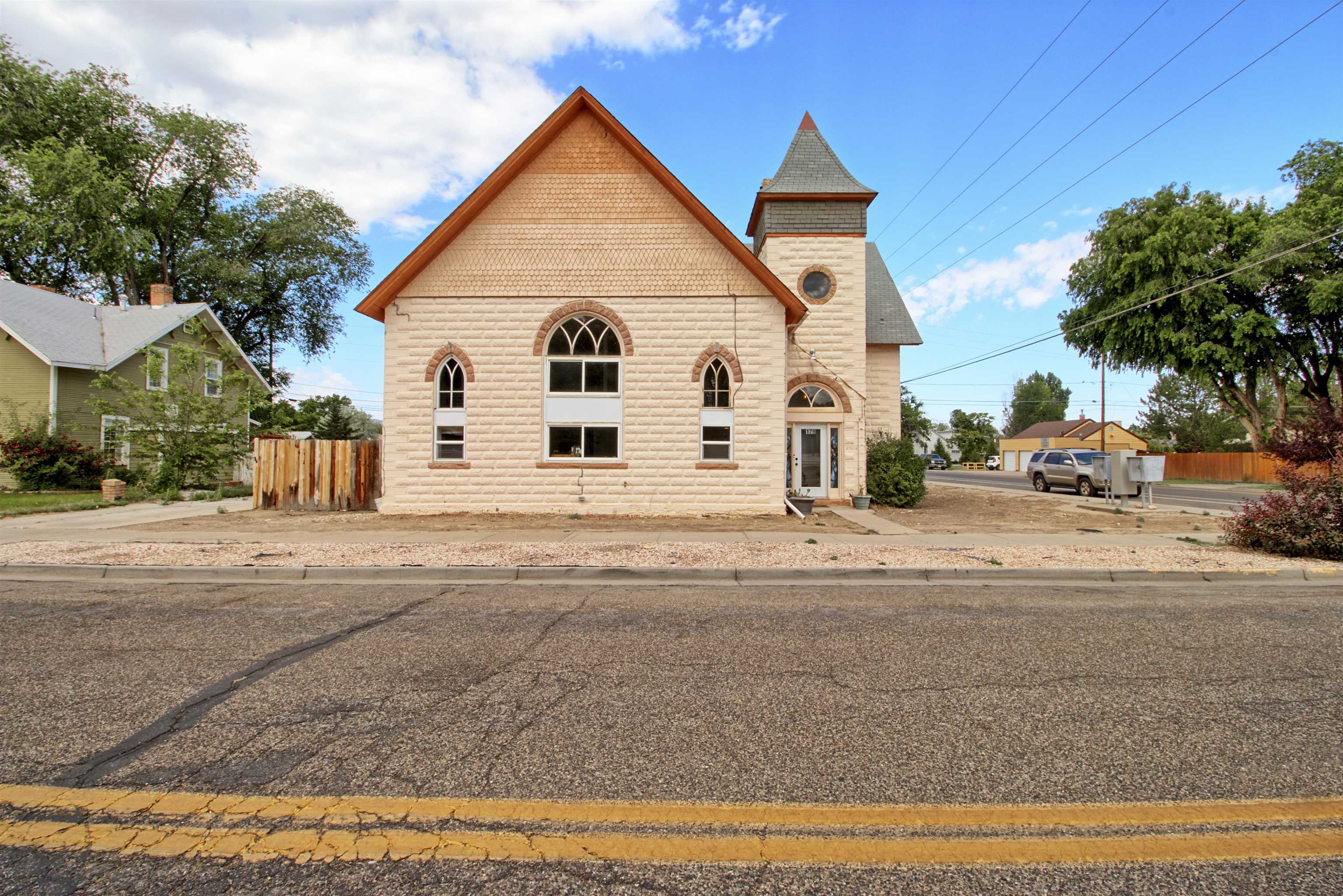 If these walls could talk…..they have housed many families over the years, lots a gatherings and served as a church for a time. Part of Fruita’s history that has stood the test of time. Interior of the home was gutted in 2018 and then reimagined into a wonderful space with quirks and character (Just like Fruita)! With 3 bedrooms, 4 baths,  multiple flex spaces, living room, family room, formal dining, breakfast nook, crazy big kitchen with concrete countertops, amazing staircase, cathedral windows and heated work space ( could be additional living quarters). Did I mention the great location? Large yard with RV parking, or ample gardens. Check with the City of Fruita about building an ADU. So much has been done to this home and now it’s ready for you to add to the History! Home Warranty is included.