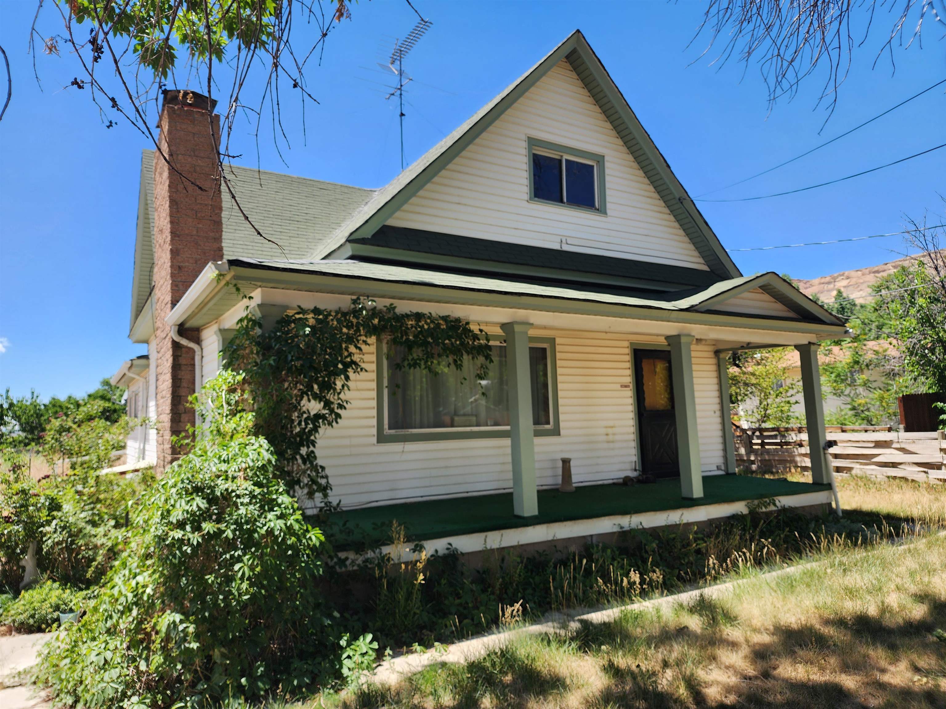 Investment opportunity and priced to sell, 1900s home off Elberta Street in Palisade, CO. This home is just a few steps away from McLean Farms. The property has mature landscape and sits on 0.34 acres. This home comes with 4 bedrooms and 1 1/2 bathrooms. Within the home are original hardwood floors, fireplace, built-ins, and forced air heating and cooling. The main floor has kitchen, 1 1/2 baths, formal dining rooms surrounded by natural light, kitchen, master bedroom, laundry, and living room. The second floor contains three bedrooms and an open area. The unfinished basement is a large open area with plenty of storage. The property also contains a one car detached garage. Irrigation water is allotted on property through Palisade Irrigation District. Irrigation water assessment is included in annual taxes @ $75.00/year. Irrigation water is accessed through pipe on property. No water shares. Water is allocated by acreage @ 5 1/2 gallons minute per acre