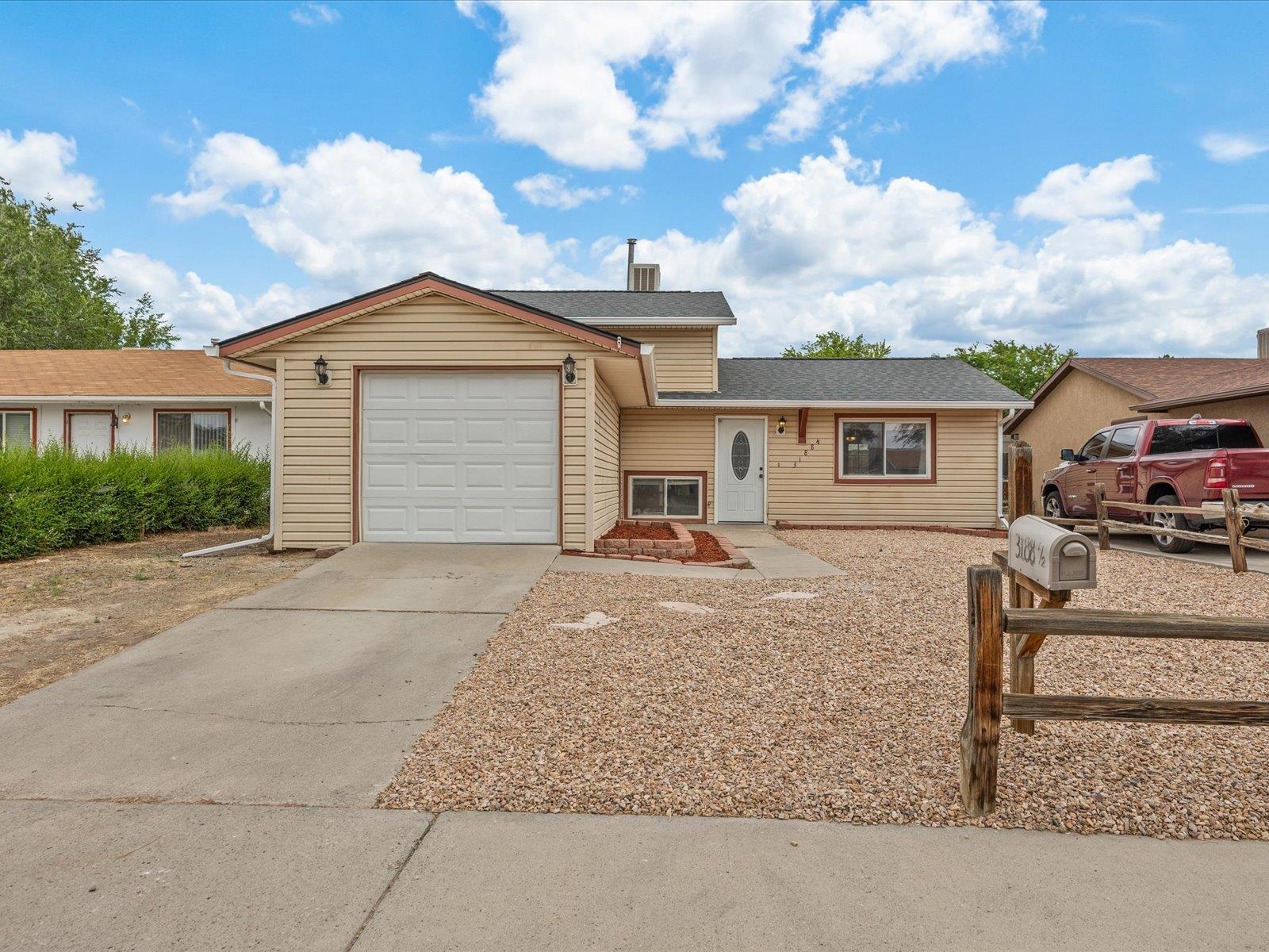 Inviting Tri-Level Home in the NE Grand Junction - Move-In Ready! Featuring 3 bedrooms, 2 bathrooms, 1,188 sq. ft., and a family room, this move-in-ready including brand new LVP flooring, a new roof with a new evaporative cooler, and an attached 1-car garage. Located close to shopping, schools and outdoor recreation, this property offers both convenience and comfort with no HOA fees. Ideal for your first home or as an investment property, don’t miss out on the opportunity -schedule your viewing today!