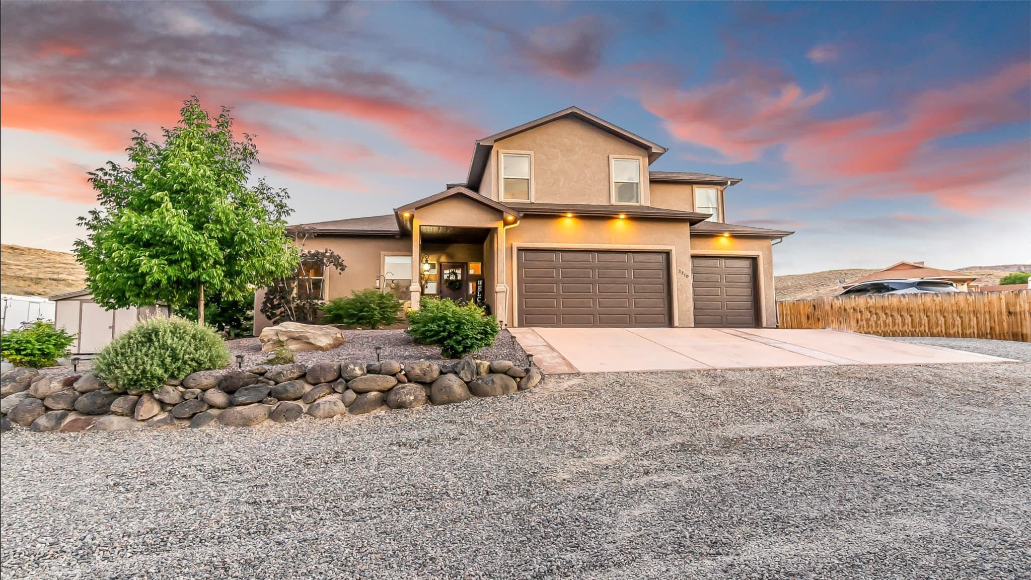 LUXURY, privacy, space, and FREEDOM in the Redlands!  This INCREDIBLE 3-bedroom, 2-living rooms, 4-bathroom, 3-car garage MASTERPIECE of a home sits on 7/10 of an acre with massive RV Parking, space to build a shop or ADU, and NO HOA!  Custom-built in 2017 and boasting CENTRAL AIR, this 2208 sq ft home boasts 3-bedroom suites (all with their own private bathroom!) plus an additional 1/2 bath for guests.  Two of the bedroom suites are on the main level, and upstairs is set up like a mother-in-law suite with its own giant living room, kitchen “space” as well as it’s own incredible bathroom with impressive giant shower, and a large bedroom overlooking mountain views that will knock your socks off!  Downstairs the kitchen is the KITCHEN OF DREAMS!  Large center island for entertaining lots of impressed guests, high-end quartz countertops, gas range for the chef, rich cobalt stainless-steel appliances, and gorgeous custom cabinets with such WOW factor!  The grand kitchen opens to the spacious living room w/beautiful gas fireplace and custom built-in shelving providing that feel of ultimate luxury.  The view from the kitchen out the back is beyond breathtaking!  Relax in your gorgeous hot tub (included) or read a book in one of your many outdoor “resort-like” living spaces.  Amazing spacious 3-car garage and RV Parking on both sides of the house, along with space to build a shop or ADU!  No pesky HOA!  Hiking trails right from your own backyard!  Attends some of the most sought-after schools in D51, as evidenced by School of Choice applications.  This particular Redlands location is actually closer to town than most of the Redlands. Close to shopping and restaurants as well as some of the best hiking and mountain biking trails in the world!  Buyer to verify all info and measurements.