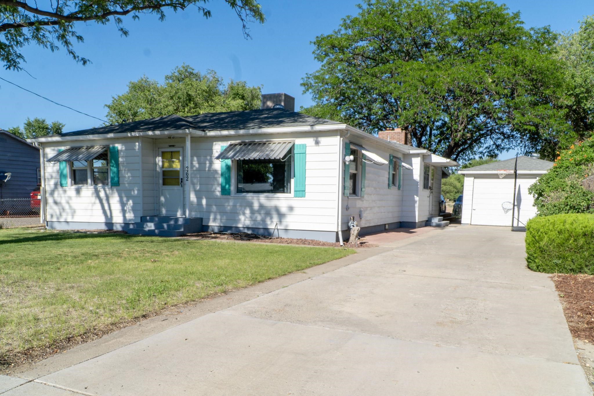 Cute, cozy, charming are all words to describe this 2 bedroom, 2 bath, 1 car garage with ample storage. From the matured landscaping to the cottage feeling that this home brings will warm anyones heart. The coziness comes from some of the original features of the home and the updated features from the current owners. Enjoy the covered deck in the back yard, the extra canning/workshop room attached to the garage. So much parking behind the house including room for an RV. Easy access to anywhere in town but the private feeling of being in the country when you are in the quiet backyard. This home features a new swamp cooler system and has new vent going into the main bedroom for those hot summer nights. Irrigation pump was added a few years ago in order to water the lawn and has a full sprinkler system.