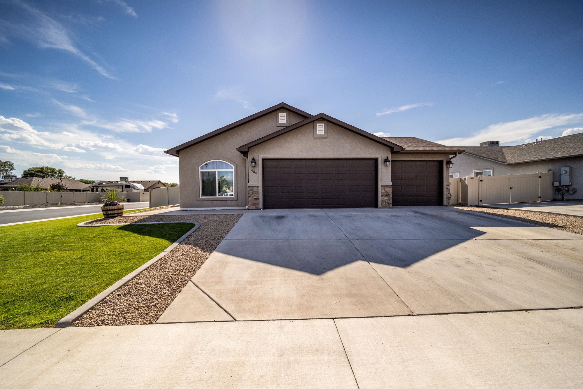 Welcome to this immaculately maintained split-floor plan home located on a spacious corner lot in Shetland Meadows. From the moment you arrive, the lovely curb appeal with its durable stucco and stone exterior and pristine front yard landscaping draws you in. Step through the front entry to find an open concept living area flooded with natural sunlight, high ceilings, and a layout that exudes grandeur, comfort, and cheer. The perfectly positioned dining area next to the chef's quality kitchen offers an ideal space for entertaining. The kitchen features abundant, attractive white cabinetry, dark contrasting granite countertops, stainless steel appliances, an oversized farmhouse sink, and a stylish subway tile backsplash. The primary suite is a retreat of its own, offering ample walk-in closet storage and an en-suite spa-like bathroom. Relax in the freestanding soaker tub or enjoy the granite-clad dual vanities and walk-in shower, which evoke serene vibes. Two additional bedrooms on the opposite side of the house provide added privacy and share a full bathroom with a tub/shower combo. The privacy-fenced backyard is a beautifully landscaped haven, perfect for hosting outdoor BBQs and enjoying the favorable Grand Valley climate. RV parking on site provides convenience and peace of mind, saving on storage fees. Conveniently located near area amenities, schools, and the I-70 business loop for commuters, this home is the perfect blend of style, comfort, and practicality. Don’t miss the opportunity to make this splendid property your own!