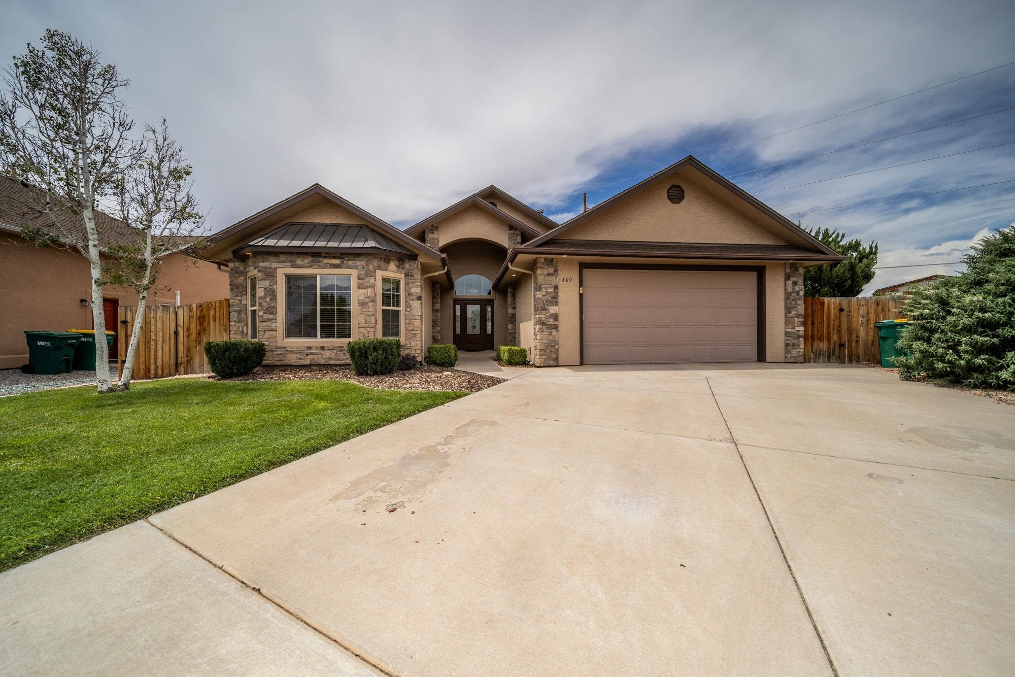 A rare gem in Vista Valley subdivision in beautiful Fruita. Built with many builder upgrades, this  low maintenance, 3-bedroom, 2-bathroom home boasts wood flooring in the living room, a rocked gas fireplace with numerous built-in cabinets and display areas, and in-floor radiant heating...and a HEATED GARAGE! With soaring vaulted ceilings, the entertaining area enjoys a buillt-in range hood and stunning black granite countertops with custom wood grain cabinetry.  Solid core wooden doors and trim add a luxurious touch throughout. The master en suite enjoys dual closets, dual vanities, a walk-in shower and jetted soaker tub, along with access to the private, covered patio area. Carpets have been shampooed and stretched. Includes newer KitchenAid dishwasher (2022) and refrigerator (2023), as well as a washer/dryer/electric range and built-in microwave. Vista Valley amenities includes parks and walking paths. This property is fully fenced and has landscaping on timed irrigation water. Water heater was also replaced in 2023, along with additional insulation in the HEATED garage,  and the 6' privacy fence along the back side was installed in 2020. This home has everything needed for easy, low maintenance living, and the pride of ownership shows through. Come see this beautiful home before it is gone!
