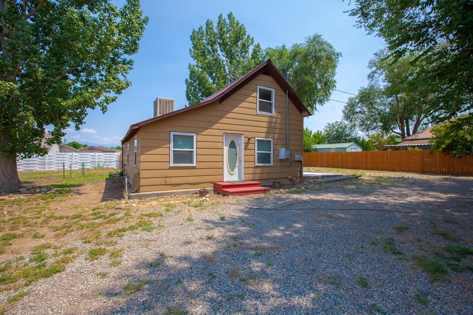 This home is one of a kind! Built in 1900 it has lovely original hardwood floors, newer windows, new interior paint. 4 bedrooms, 2 are upstairs and 2 are downstairs (one down stairs does not have a door currently). There are 2 bathrooms and a laundry room downstairs. The half-acre lot has a large 2 story shed and a new shed plus all the room you could need for toys or cars! New patio off the kitchen for you to make your own! Come see this beauty today.