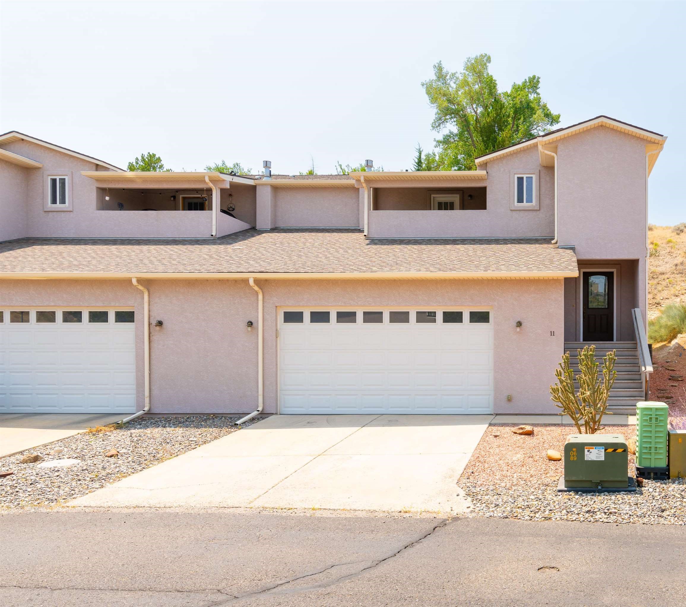 Welcome to this charming townhome in the desirable Ridges neighborhood.  This three-bedroom, three-bathroom home offers a large primary suite complete with a walk-in closet and tiled shower.  The open floor plan boasts a kitchen with pantry for added storage space, dining area with lots of natural light and a living room that is anchored by a cozy fireplace.  Stay comfortable year-round with central air conditioning and forced air heat.  The oversized two-car garage provides ample parking and storage options.  Outside, a small backyard offers a private outdoor oasis.  With new carpet, fresh paint and updates throughout, this home is move-in ready.  Don't miss out on this fantastic opportunity - schedule a showing today!