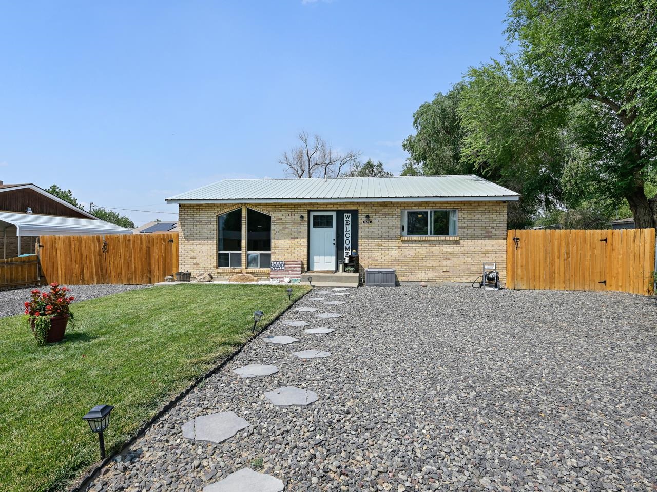 Welcome to the heart of Fruita, where you’ll find one of the cutest and most charming homes just off East Carolina Avenue. With many recent upgrades and remodels this is a must see! For starters you’ll be located very close to downtown Fruita, where you can enjoy unique and one of a kind shops and restaurants. Additionally you’ll find you are never too far from some outdoor adventures with the Colorado National Monument just a short drive away. As you approach the home, notice the front landscaping and nice fencing, recently upgraded in 2021. Additionally the driveway was upgraded in 2022. Head on inside and find a clean and atmospheric living space with large front facing windows which brings in the natural light. The combination kitchen/dining room offers a great space to enjoy your meals. Not to mention the kitchen was remodeled in 2021 and looks fantastic! Down the hall are the two bedrooms and full bathroom.  The primary offers lots of space and a nice walk-in closet. Out back you’ll find a beautifully landscaped yard upgraded in 2023. A new 2024 shed is ripe with potential. The 10x16 space could be the perfect spot for a small shop if electricity is added. There is much to see in this newly upgraded property. Don’t miss out! Schedule a showing today.