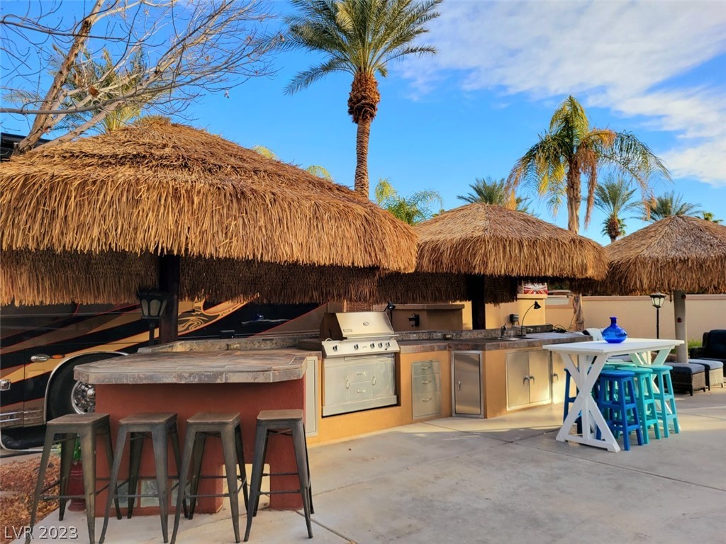 Located within the Class A Las Vegas Motorcoach Resort, this “Old Town” privacy site is fully built out with 3 shade palapas, a full kitchen, bar top seating and a shady seating area at the rear of the site, as well as storage.