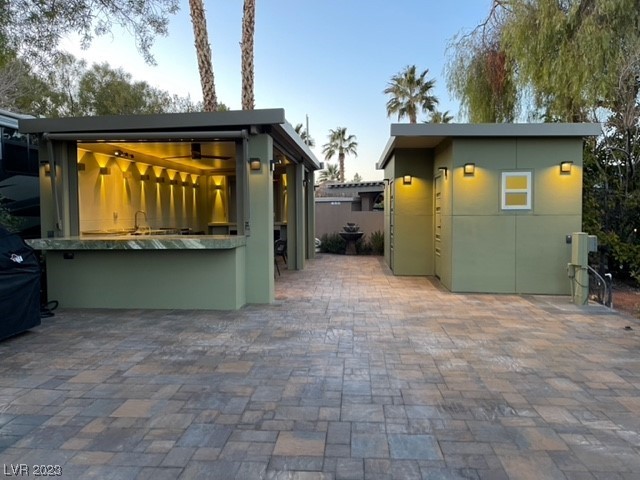Located in the guard gated Las Vegas Motor Coach Resort, this site is an “Old Town” Masterpiece!!!    This extremely custom site is pure perfection with no expense spared throughout! Built unlike any other in the resort, this amazing site features a stone paver driveway, two hard roof structures, gorgeous marble countertops, motorized shades, spacious chef’s kitchen, living room area with TV niche and fireplace, custom lighting throughout, ceiling heaters, separate structure with comfort station, storage, and much more!