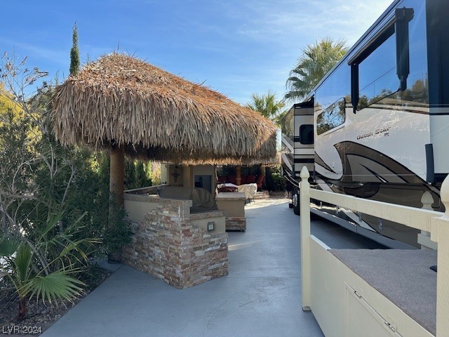 Located in the guard gated Las Vegas Motorcoach Resort, this site is super private and cozy!   This gorgeous north facing site is all dialed in with multiple palapas, a full kitchen with island and granite countertops, private seating area, storage sheds and much more!   Lots of bang for the buck!  OWNER WILL CARRY!