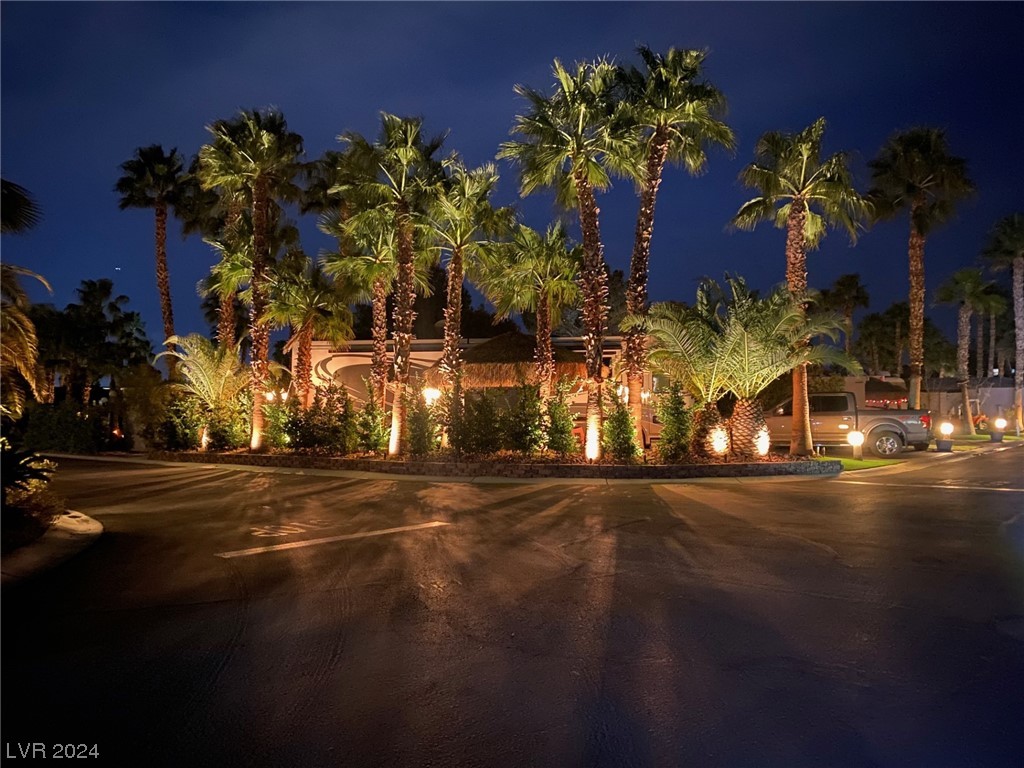 Located within the Class A Las Vegas Motorcoach Resort, this over-sized corner site is well located across from the main clubhouse and surrounded by towering palm trees and lush hedges. It has been beautifully upgraded with an epoxy coated pad, a full outdoor tiled kitchen and bar area that includes a barbecue, fridge, & sink. There's also additional seating and a water feature in front. Truly a special site!