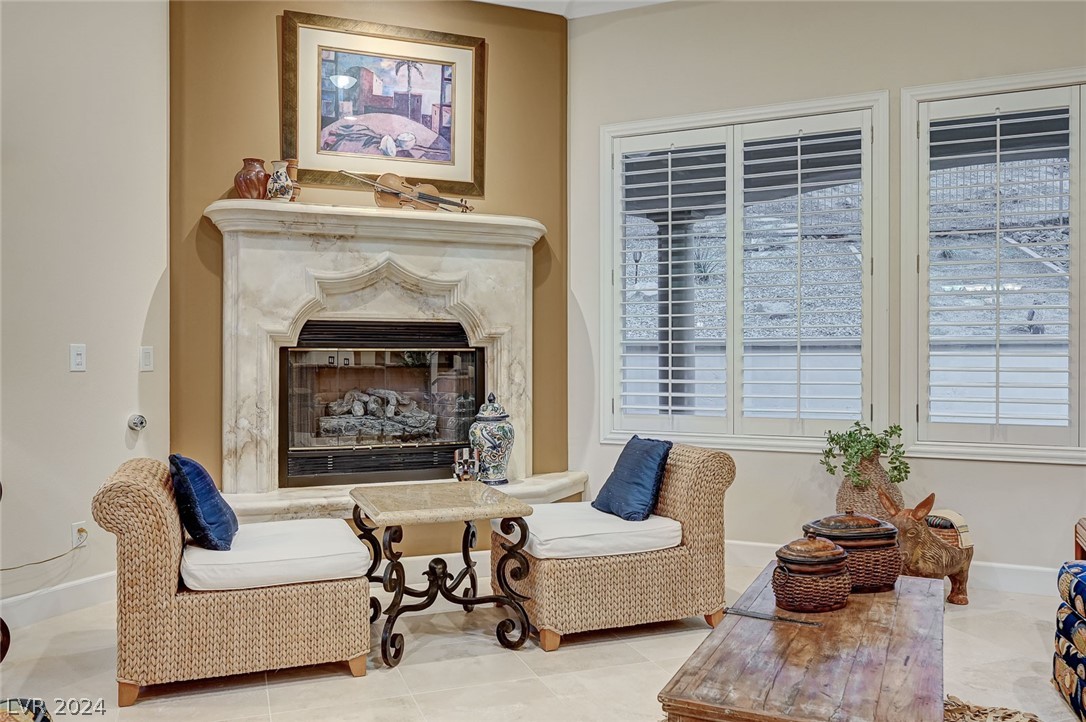 The living room fireplace offers a cozy space to relax in the living room.