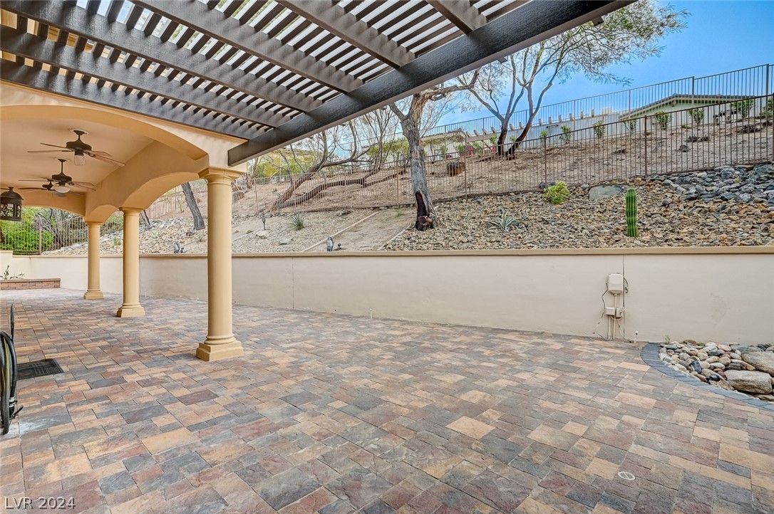 The patio and backyard offer ample privacy for relaxation or entertainment.