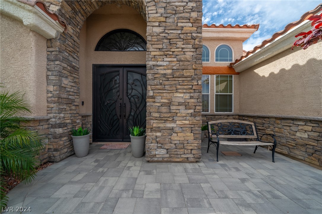 Covered entry with pavers.
