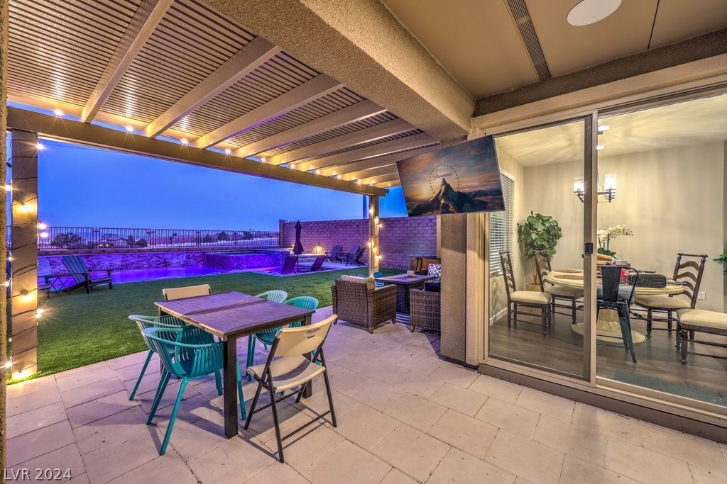 Spacious covered patio area and yard with City Views.