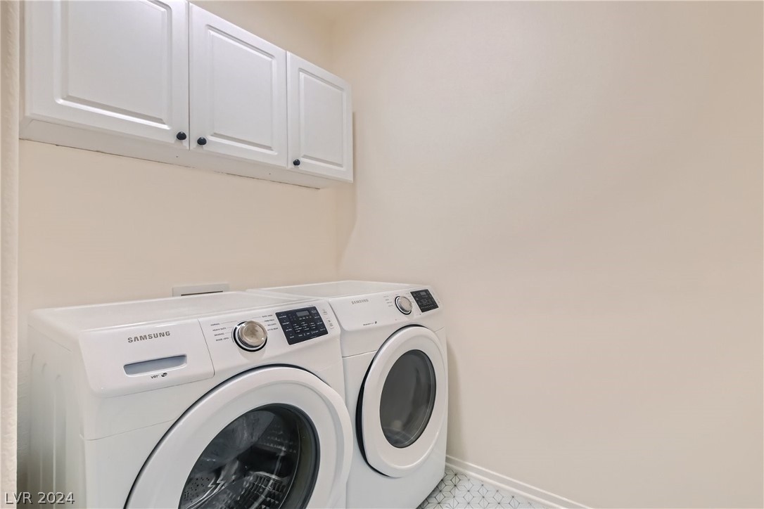 Separate laundry room has automatic light and washer and dryer stay!