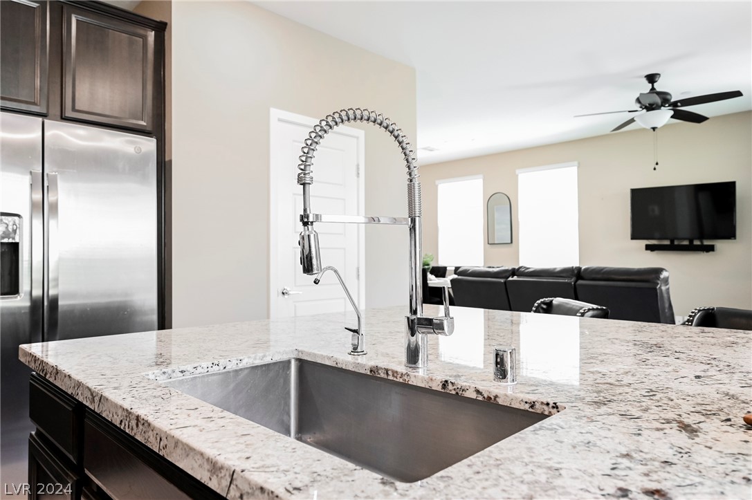 Oversized stainless steel sink and faucet.