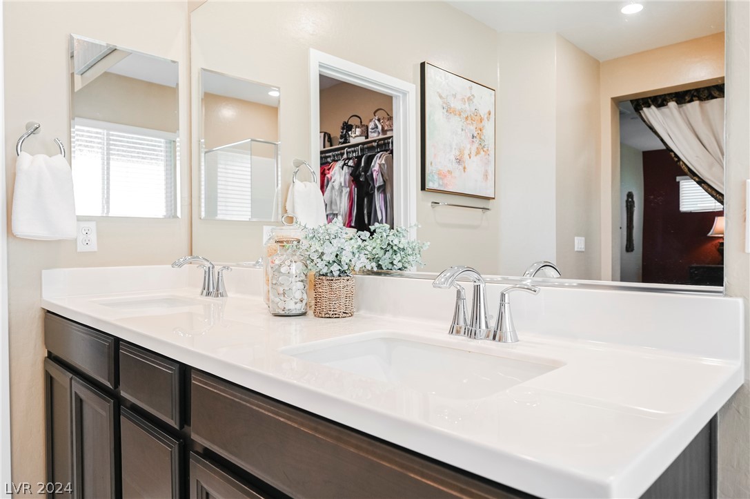 Large primary bath with dual sinks, shower, large soaking tub and separate WC.