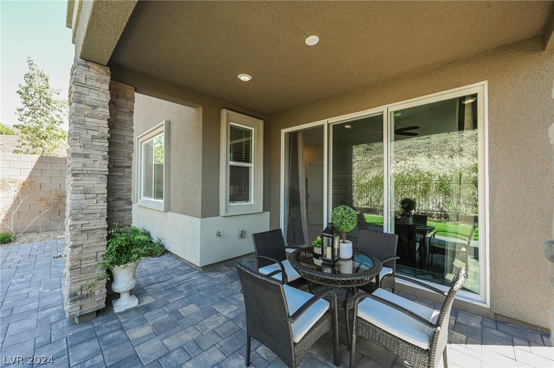 Paved and covered patio is located off the living room. Stacked sliding door opens the space in the living room and allows the amazing views into the home.