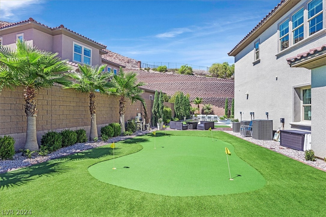 Side yard with putting green.