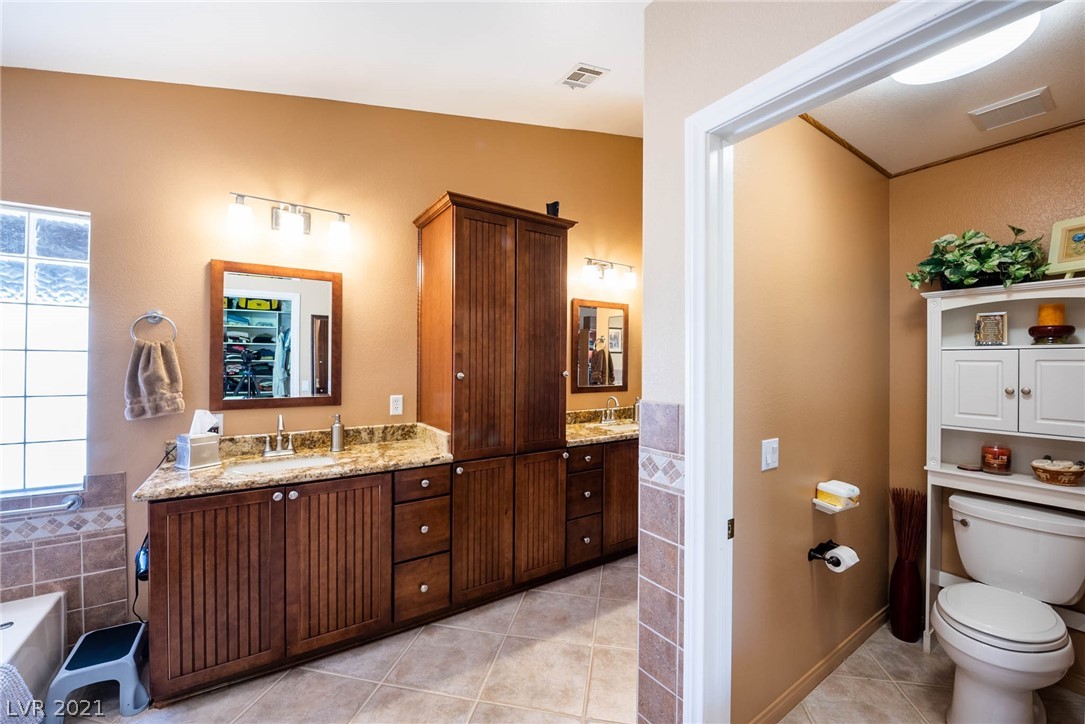 MASTER BATH WITH CUSTOM CABINETS, TILE FLOORS; SEPARATE WATER CLOSET