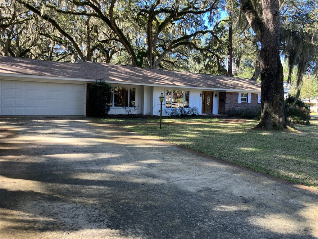 Extremely well maintained Three bedroom, two bath home,  Spacious home with living/ dining,  kitchen/Den with fireplace, glassed in porch,  two car garage.  Located on corner lot  and all woods to the east.  Call today to see this great buy. Jekyll Island Authority will require a survey at time of closing.  More pictures will be added next week.