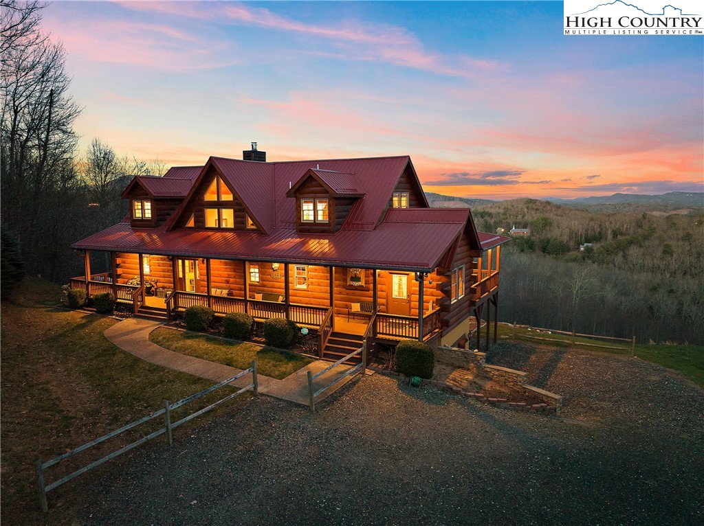 This stunning log home is perched atop a mountain, offering breathtaking long-range eastern views from nearly every room that will leave you in awe. Featuring five spacious bedrooms and four and a half baths, this home is perfect for large groups looking for a comfortable and welcoming retreat. There is an office/bonus space that is currently being used as a sixth small bedroom, complete with closet. The open loft and two living areas provide ample space to relax and unwind while the hardwood floors and wood-burning fireplace exude warmth and charm, creating a cozy atmosphere that will make you feel right at home. This fully furnished and equipped home has all the necessary amenities, including a hot tub, pool table, and outdoor fire pit, making it the perfect place to entertain guests. The almost 1300 s/f of large decks on the front and back of the home offer plenty of space to take in the breathtaking views and soak up the sun, while the expansive kitchen and eat-in area make it easy to prepare and enjoy meals together. The pantry provides plenty of storage space, ensuring you'll always have everything you need. This home is truly a rare find, with a six-bedroom septic system and a location perfect for those who want to be surrounded by natural beauty and tranquility. The current owners have used this home solely as their mountain getaway, so it's ready for you to move in and start making memories. This home would also make an incredible short-term rental. Take advantage of this once-in-a-lifetime opportunity to own a magnificent mountain-top log home near the very top of the charming Fleetwood Falls community that will take your breath away.