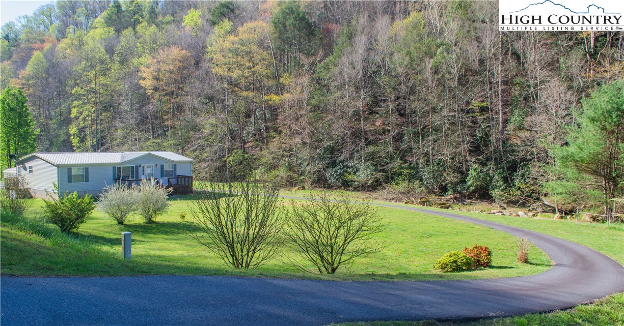 Come check out this Beautiful Turn Key Property overlooking Elk Creek in the heart of Deep Gap. Situated on a nearly flat lot- this property boasts a great yard for outdoor activities as well as fishing right from your own yard. The home has 3 spacious bedrooms, living room, kitchen, dining area and a third entry into the mud room/laundry room
With additional acreage "above/adjacent" the property there is also potential to expand and build another home-or really whatever your hearts desire. Don't miss out on this amazing property.