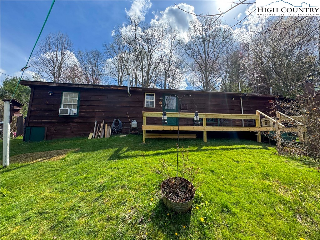 MOTIVATED SELLER! Convenience of town with the quietness of mountain living. This cozy cabin nestled in the cove has  NO RESTRICTIONS. You can homestead or have short term rentals. This newly remodeled home has new plumbing, new roof with gutters, sealed foundation, new pellet wood stove with propane backup, well installed in 2018, new siding with 8" walls, new flooring, new driveway created and graveled, and the newest addition being an 8'x32' deck!  Come check it out!
