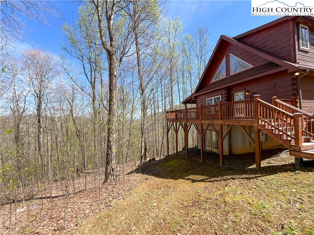 Don't miss out on this amazing log cabin nestled at the top of the community of Falling Waters! This cabin offers a perfect escape from the hustle and bustle of everyday life. Whether you're looking for a serene mountain retreat to call your own or an investment opportunity in the short-term rental market, this property offers the best of both worlds.  The layout of this cabin makes it an ideal retreat for hosting family and friends, while still providing each guest with their own space to relax and unwind. With a spacious deck, you can enjoy your morning coffee amidst the treetops or relax in the hot-tub after a full day of exploring the beautiful High Country. There is a full finished basement with additional sleeping space.