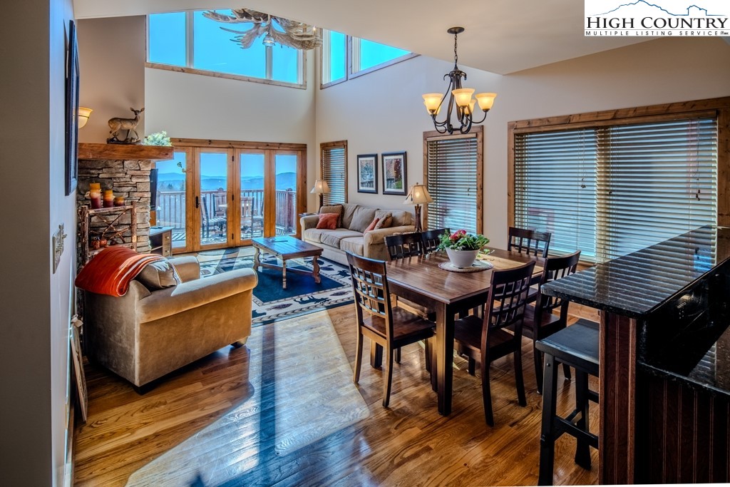 This stunning three-bedroom, 3.5-bath townhome boasts stellar long-range layered views. Imagine waking up each morning to the sight of Grandfather Mountain as your focal point. This home is a place to experience and appreciate the beauty of nature. Whether you're relaxing on the deck with a cup of coffee in hand or cozying up next to the fireplace on a chilly evening, every moment spent here feels like a retreat. With modern amenities and luxurious finishes throughout, this townhome offers comfort and style. The open-concept living area is great for entertaining guests or simply enjoying time with family. And with three bedrooms and 3.5 baths, there's plenty of space for everyone to feel at home. This townhome has two steps that lead inside. The kitchen, dining and living room all flow out to the spectacular views on the deck. The primary bedroom with an en suite is on the main level as well as the laundry room that leads out to the garage. The upper level offers two guest bedrooms and a full bath with an open loft that looks over the living room. Head down to the lower level for entertainment as there is a pool table, a large family room, a full bath, and a bonus room. Don't miss out on the opportunity to make this mountain escape yours. Just minutes from Banner Elk and all that the town has to offer. Summer concerts, wonderful restaurants, shopping and more. Beech Mountain Resort is just up the mountain with skiing, snowboarding, tubing, summer and winter concerts, mountain biking and more!
