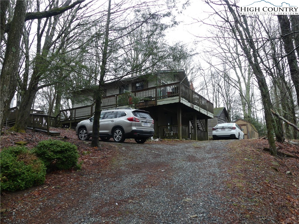 Great location between Banner Elk and Beech Mountain.  County taxes only.  This is an AS IS property, it will need some love and TLC. Furnace does not work. Heat is a propane fireplace and space heaters. This is a Jim Walters built home.   Owner has done work in the lower level. A second bathroom is plumbed in the lower level.  Great neighborhood and convenient to community events, activities, and attractions. Come make this your special mountain getaway or full time residence.