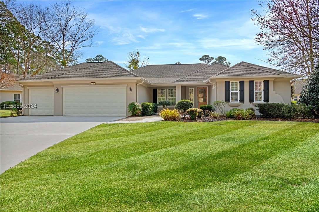 Gorgeously updated ranch home in upscale waterfront community of Riverbend w/ beautiful lagoon view! Modified Longleaf model w/ Carolina room & 3 car extended garage (with epoxy coating) offers an open floorplan w/neutral tile in most of the rooms & wood flooring added in primary bedroom & hall, 3 bedrooms + den/office & an exercise room/private 2nd office off primary bedroom.  Luxuriously updated primary bath & updated 2nd bath.  So many upgrades including plantation shutters, built-ins, roof & gutters (2013), electric water heater (2016). Enjoy all the amenities Sun City has to offer plus the Riverbend lifestyle that is waiting for you!