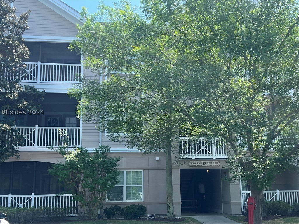 Welcome home to this sunny & spacious 3 bed 3 bath 2nd floor condo with elevator access. Centrally located close to old town Bluffton & just a short drive to HHI or Savannah. 2 of the 3 bedrooms have ensuite bathrooms. Plenty of storage with walk in closets in every bedroom. Enjoy peace & quiet from the private balcony with a wooded view. Monthly regime fee covers the exterior, common area & pool maintenance, landscaping, capital reserve, insurance, pest/termite control, condo water/sewer & trash pickup. Enjoy maintenance free living at its best!