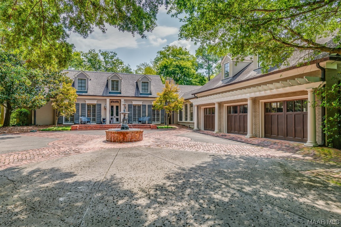Professionally designed and renovated with the highest quality materials and finishes. This elegant, 4 bedroom home is comprised of approximately 4,800 sq.ft, with an additional 600 ft. of living space over the garage. Absolutely gorgeous setting on a deep Edgewood lot. The home has undergone two significant renovations by architects Jim Barganier and Ray Williams, most recently in 2006 which included a new kitchen and laundry, three car garage with upstairs office and massive walk in closet, and many other improvements. Timeless quality with 20 ft. vaulted foyer, cove molding, hardwood floors, 5 fireplaces and gas lanterns. The chef's kitchen features a large island w/breakfast bar, 6 burner Dacor gas cook top with pot filler and copper hood, WOLF double oven, Sub Zero fridge and freezer drawers, ice maker, abundant custom cabinetry, prep sink, wood ceiling, walk in pantry and adjacent butler's pantry with beverage fridge. The kitchen opens into a light filled sun room and separate den, each with fireplaces and easy access to beautiful patios. The living room and dining room are exquisite with floor to ceiling windows and plantation shutters. Spacious utility room and hallway with brick floor leads to 3 car garage with stairs to 2nd floor office and large storage room. Rounding out the first floor is a guest bedroom with ensuite bath. The second level offers 3 bedrooms, each with its own bath, and 2 fireplaces. Beautifully landscaped front to back with mature trees and plants, well fed irrigation and landscape lighting. The rear covered porch is the ultimate spot to gather by a fire. Deep, fully fenced backyard with fantastic sports court and nearby rec room. Truly a special home with incredible curb appeal, style and function.