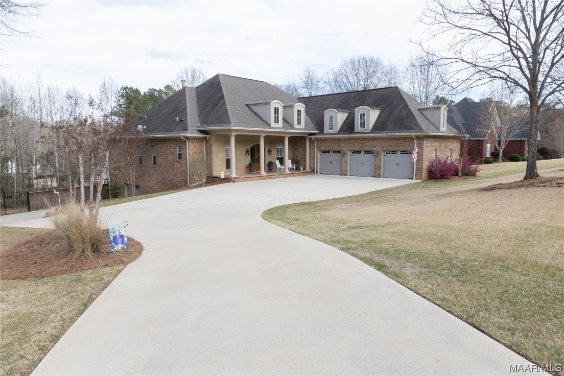 Welcome to 1011 Longfield Drive, Prattville, AL! This stunning home boasts a beautifully designed living space on over an acre of land in a walkable neighborhood. The home is custom built with designer features throughout.  Hardwood flooring through most of the main living areas, spectacular crown molding and custom cabinetry throughout. The main level has 4 bedrooms, 3.5 baths, formal dining area, large breakfast room & great room overlooking a dramatic covered porch and pool.  The chef’s kitchen has stainless steel appliances with double ovens & a gas range, beautiful granite countertops, tile flooring & additional seating with bar top. There are 10 and 11 foot ceiling heights throughout. All bedrooms have access to bathrooms ideal for family members or guests. The basement offers a rec room with impressive brick wall, workshop, & a bar, making it an ideal space for both work & play on slate floors. An additional bedroom & bath complete the basement space. A walk out from the basement is another covered living space inviting you to the salt water pool which has a new liner. The backyard is fully fenced. One of the incredible features of this home is the workshop which has a garage entry. This space is approximately 29’X37’. Imagine the possibilities with this space! Another addition to this area is a very large storage area & workout room. A bonus room over the 3 car garage completes the living area and would work great as a playroom, office space, rec room or all of the above. Each area of the home has it’s own HVAC system. Some new items recently replaced are new pool liner, new roof (waiting to be installed), new tankless water heater, new HVAC, new ice machine, cabinets in garage & workshop, dishwasher and new LED overhead lighting in shop & storage room. Main floor & bonus room 4155 SF. Basement living space 1623.5 SF. This home has everything any new homeowner would love. Don't miss out on this incredible opportunity to own a luxurious home in Prattville!