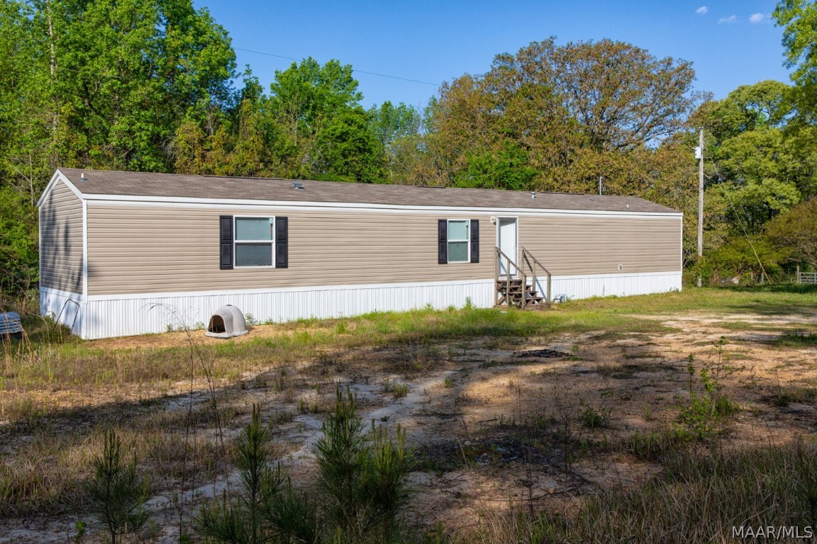 Country Living is just minutes from downtown Wetumpka. Modern 2020 Manufactured home situated on 1 acre and zoned for Redland school district.  Open concept for kitchen and living area. Split bedroom floor plan. Vinyl plank flooring throughout the home. The main bedroom offers an ensuite with an oval soaking tub, a separate shower, and a walk-in closet. Secondary bedrooms located on the opposite side of the home share a bath.  Plenty of storage space and ample closet space as well. Everything is 4 years old including the HVAC and septic system. Low E windows. Lots of space for parking.