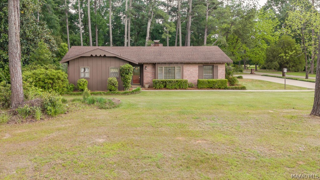 OPEN HOUSE THIS SUNDAY APRIL 28TH FROM 2 TO 4 PM.  Come take advantage of this RARE opportunity to own a great 3 bedroom 2 bath home on a large corner lot in Wetumpka's Blue Ridge Estates!  This charming home has 1789 sq ft and includes a large living room, dining room, cozy den with fireplace, 2 car covered carport, roomy kitchen, a HUGE detached garage with workshop, a very convenient circular driveway, large patio area, and it sits on almost a 1 acre corner lot that is partially fenced!  As a bonus for the new buyers, the owners just had the septic tank pumped and serviced and had the HVAC system serviced as well. There is fresh interior paint in several rooms as well.  The seller is also offering a 1 year Home Warranty from APHW. This home is convenient to shopping, grocery stores, gas stations, and Highway 231.  Please call us or your favorite Realtor today for a private showing!