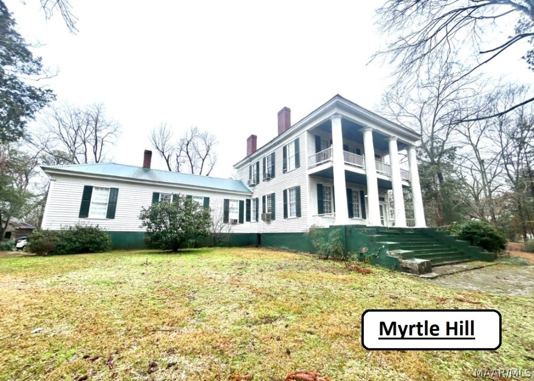 Located on 5.5 ac within a mile of downtown Marion, AL, we offer this Antebellum home, MYRTLE HILL, c.1840. To be noted, there are available 2 Antebellum homes secured behind a Wrought Iron fence, a cottage perfect for a grounds keeper, and a vacant residential lot.   The antebellum homes were built by John Huntington a silversmith from North Carolina, and have been listed on the National Register of Historic Places. Entering the front of MYRTLE HILL, through it's 4 stunning Doric Columns, past a most striking stairway, we find the formal Living and Dining Rooms. The lovely mantels and beautiful chandeliers found here are offered throughout these homes. The 3315 sq.ft. home features 4 Bedrooms, 3.5 Baths and Breakfast joining the Kitchen. The back sitting porch overlooks azaleas, hydrangeas, camellias and a water feature that includes a water fall.  In 1907, it was purchased by Mr. and Mrs. William Caffee, who's daughter Ruby named the home for the Crepe Myrtles blooming at the time. Ruby lived in the home until age 95, when it was sold to the Lewis family who restored it to become Myrtle Hill Bed and Breakfast & Gardens in 1994. Myrtle Hill remained in the Lewis family until purchase by it's current owners.  Joined behind the stately Wrought Iron Rence is the second Antebellum, BELLE TERRACE, C.1838, also built by the Huntingtons, which includes a 1 Bedroom, 1 Bath Carriage House. BELLE TERRACE is offered under separate listing as 305 West Lafayette Street.  Included with the MYRTLE TERRACE property is a .51ac vacant lot, should an owner wish to build a home to complement the properties.  Another home that's adjacent to this, and could be purchased, is a CARETAKER'S COTTAGE, a 1 Bedroom, 1Bath well maintained home and is shown under separate listing at 219 West Lafayette Street. With all these properties have to offer, it's well suited for multi-families looking for a quiet, home away from home or as your individual purchase of a part of history!!