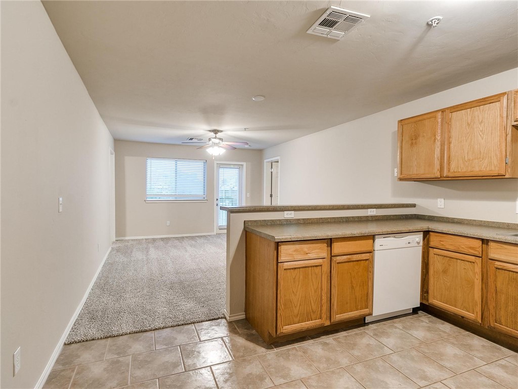 Looking for an awesome investment opportunity or wanting to be in a trendy skyrise campus condo?! This 2nd floor condo boasts 2 bedroom, 2 baths and 1027 square feet of modern charm. East-side unit is near Norman amenities and just a short scooter drive to OU's campus. Spacious living room is cozy with open floor plan to kitchen. Cook for 2 or 20 in the kitchen that has a refrigerator, dishwasher, microwave and an electric stove along with cabinet space galore. It's hard to find condos that also have washer/dryers! Enjoy luxury living with condo life that provides the ultimate clubhouse that features a pool table, poker table, full kitchen for entertaining and a theater with TV. There is an on-site fitness center! If you have fur babies, you will enjoy the on-site dog park. Whether you are wanting to enjoy low maintenance living or looking for an investment property to house your student while attending school; this is the place! Complex has an elevator making 2nd story living EASY!