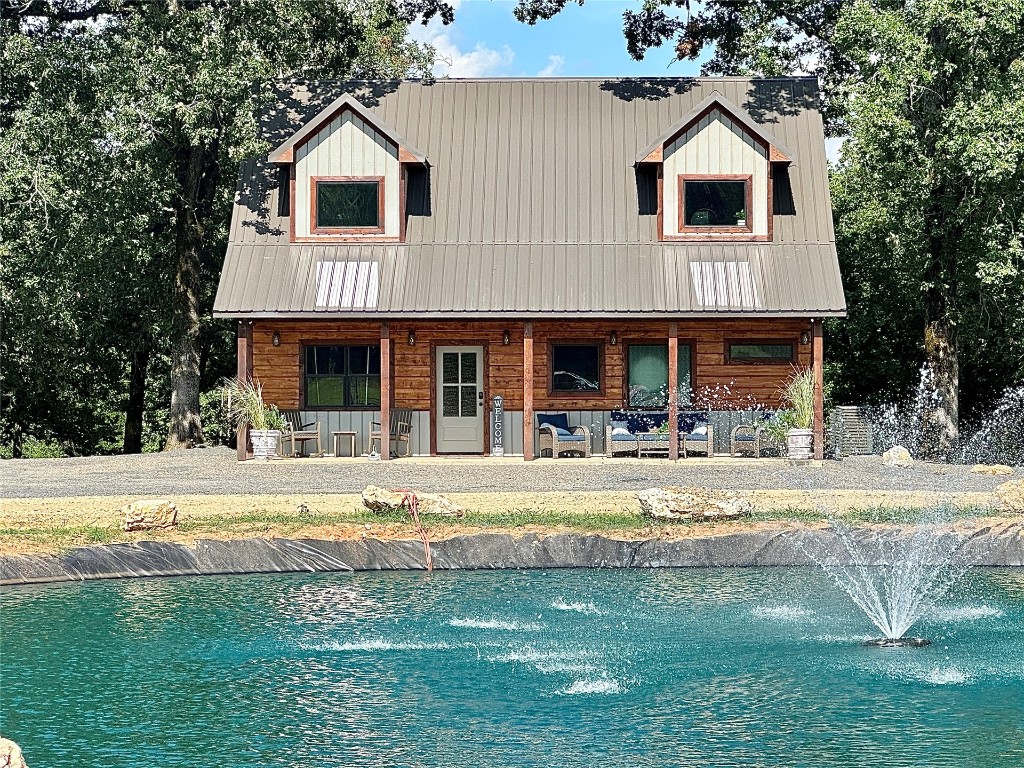 This modern rustic 3 bed 3.5 bath cabin is nestled on 1.328 acres in the Camp Ranch Estates, features a pond with fountain and huge beautiful oak shade trees! This is the definition of peaceful. Minutes away from the heart of Hochatown and all the recreational activities it has to offer. Whether for family or investment, this cabin is the perfect destination for all occasions.